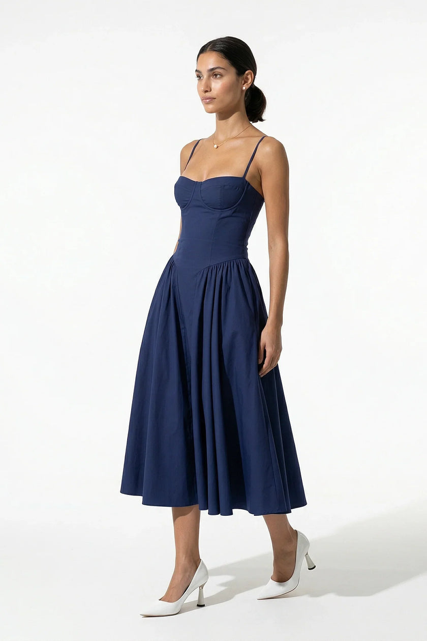 Deep blue FJØRNA sleeveless backless pleated midi dress with halter neckline, ideal for occasions, full-body view.