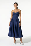 Deep blue FJØRNA sleeveless pleated backless midi dress with halter neckline, perfect for occasions, shown on a model.