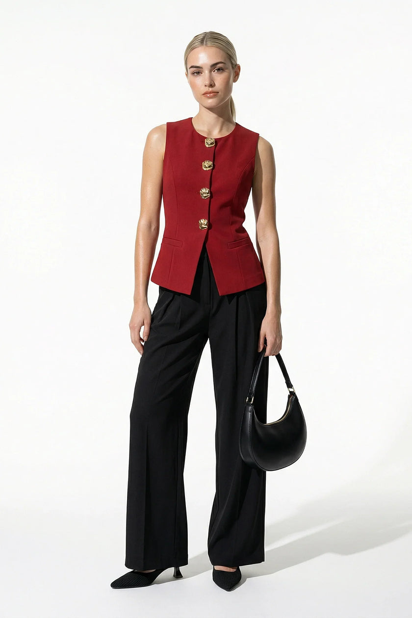 Women’s deep red sleeveless waistcoat by FJØRNA with metal buttons, stylish layering piece, full-body view.