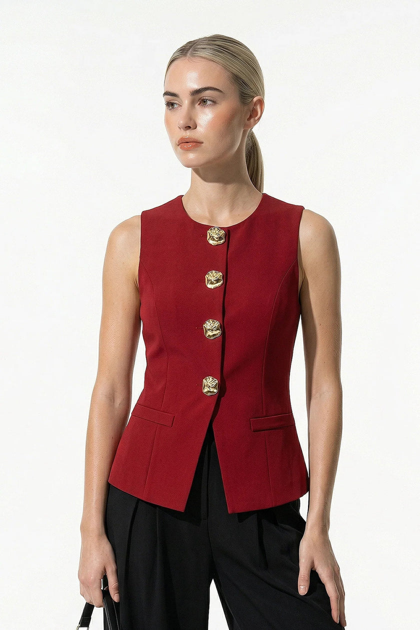 Deep red women's sleeveless waistcoat by FJØRNA with metal buttons, featuring tailored fit and layering style.
