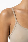 FJØRNA sleeveless beige bodycon maxi dress for women, perfect for summer business occasions, close-up detail shot.