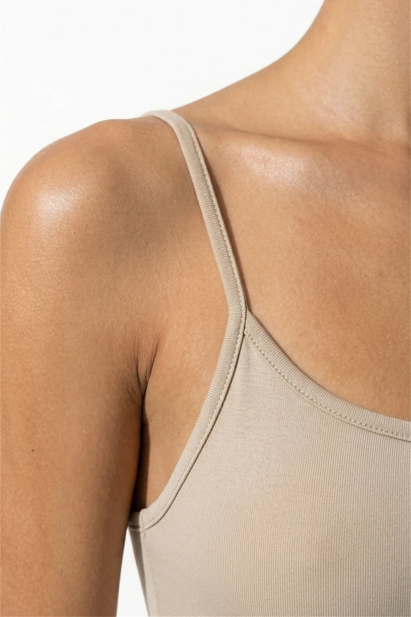 FJØRNA sleeveless beige bodycon maxi dress for women, perfect for summer business occasions, close-up detail shot.