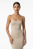FJØRNA beige sleeveless bodycon maxi dress for women, perfect for summer business occasions, shown in a medium shot.