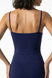 Navy blue FJØRNA women's sleeveless bodycon maxi dress, close-up of fitted fabric and elegant summer design.