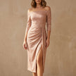 Champagne-colored FJØRNA elegant midi dress for women, off-shoulder bodycon knit style, shown on a model.