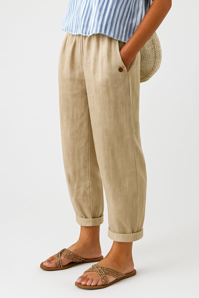 FJØRNA lightweight summer women's trousers with straight leg fit, breathable fabric, and front pockets, ideal for warm weather.