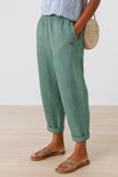 FJØRNA lightweight summer women's trousers with straight leg fit, breathable fabric, and practical pockets.