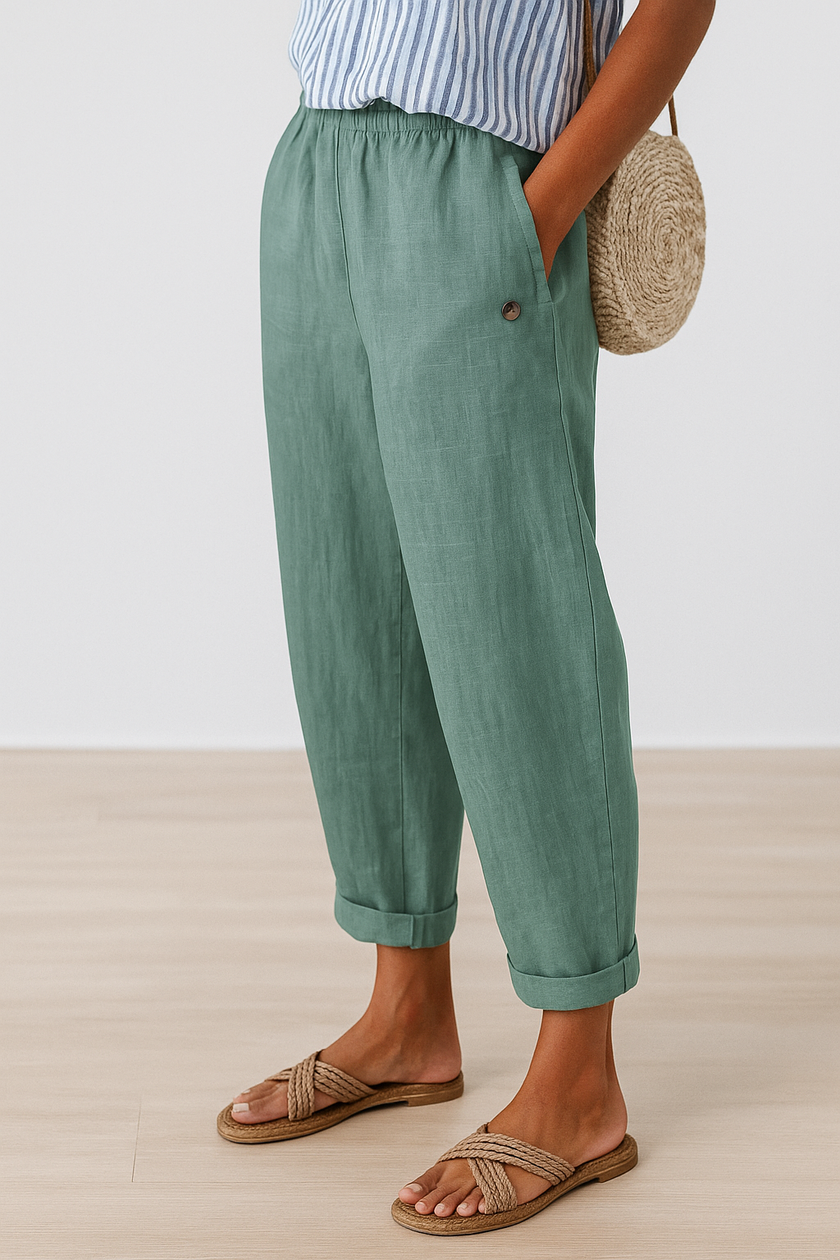 FJØRNA lightweight summer women's trousers with straight leg fit, breathable fabric, and practical pockets.