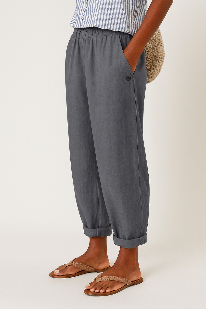 FJØRNA lightweight summer women's trousers with straight leg design, breathable fabric, and front pockets for casual comfort.