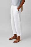 Women’s lightweight summer trousers by FJØRNA with straight legs, breathable fabric, and side pockets for a stylish, comfortable look.