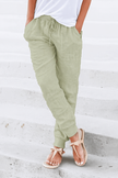Lightweight women's summer jogger pants by FJØRNA with wide leg and tapered fit, ideal for casual warm-weather wear.