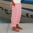 FJØRNA lightweight summer women's trousers with straight leg fit and elastic waist, perfect for casual warm-weather wear.