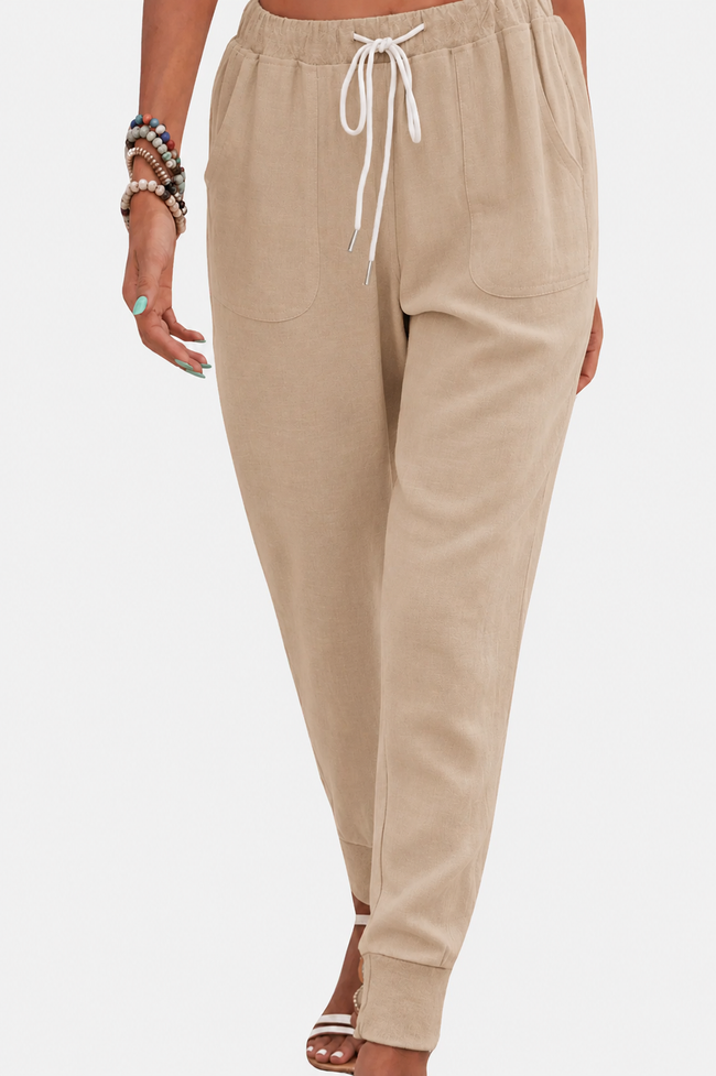 FJØRNA women's lightweight summer jogger pants with wide-leg, tapered design, casual trousers for warm weather.