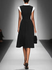 FJØRNA colorblock midi dress for women featuring a stylish combination of vibrant color panels and a flowy midi length.