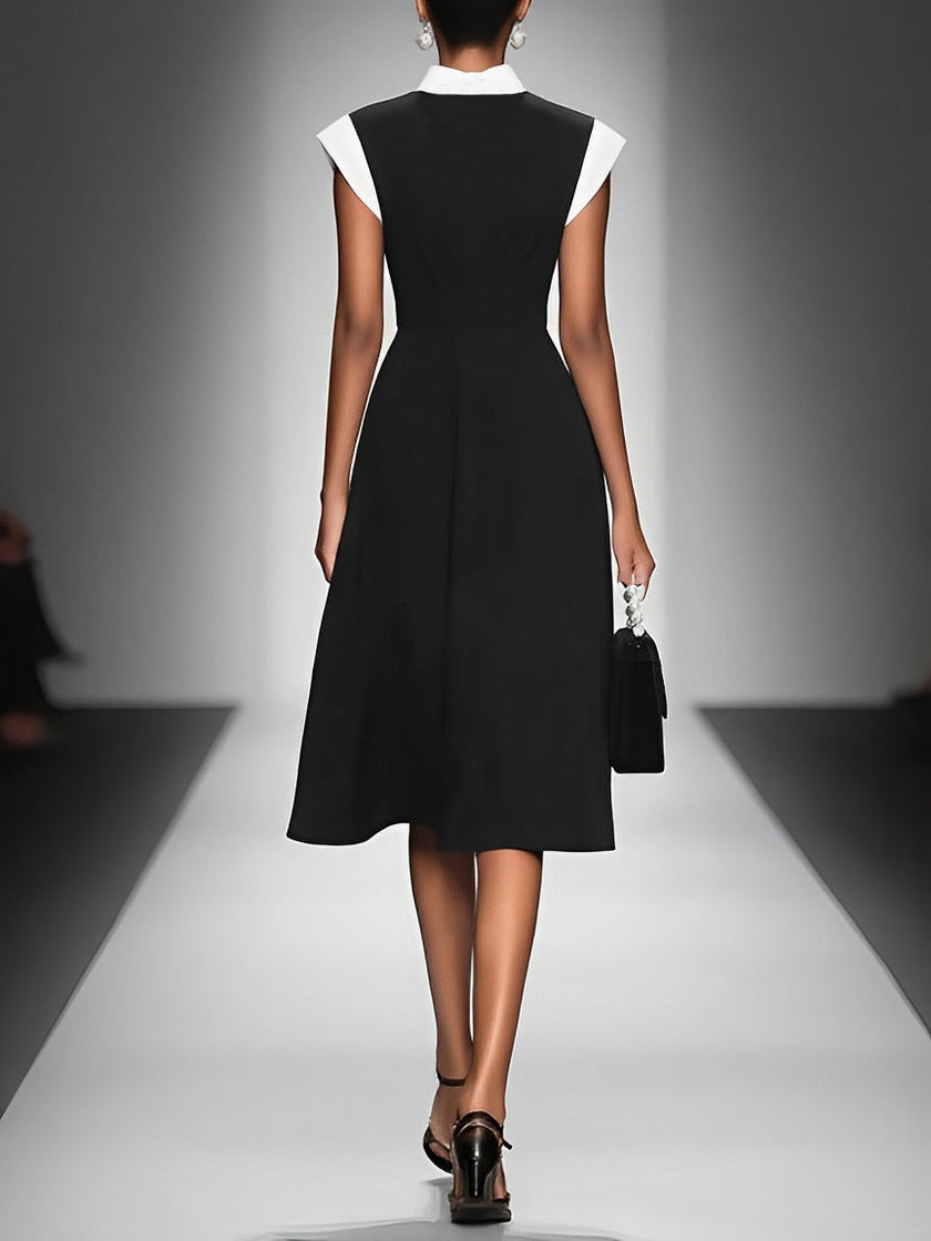FJØRNA colorblock midi dress for women featuring a stylish combination of vibrant color panels and a flowy midi length.