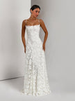 Elegant floral lace spaghetti strap maxi dress by FJØRNA featuring a flowing silhouette and intricate lace detail for evening wear.