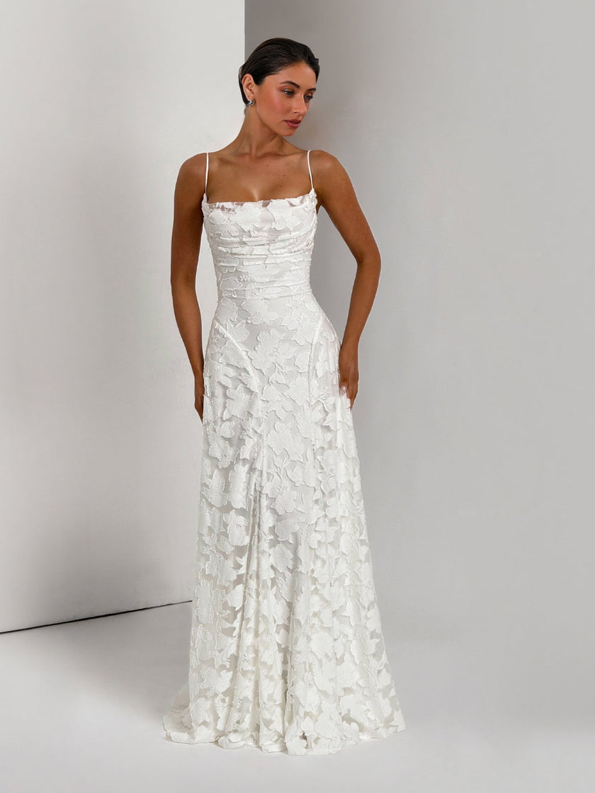 Elegant floral lace spaghetti strap maxi dress by FJØRNA featuring a flowing silhouette and intricate lace detail for evening wear.