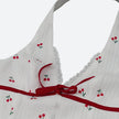 FJØRNA Coquette Cherry halter neck mini dress with playful cherry print, perfect for party and daytime wear.