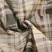 FJØRNA Coquette plaid mini dress for women, featuring a stylish party and day wear design with a fitted silhouette and plaid pattern.