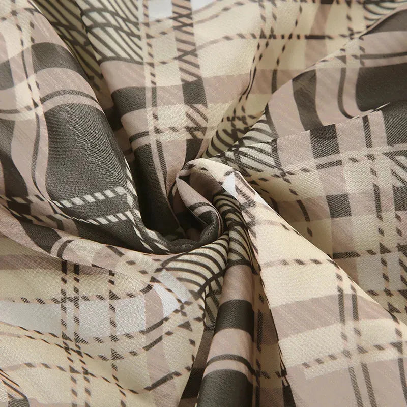 FJØRNA Coquette plaid mini dress for women, featuring a stylish party and day wear design with a fitted silhouette and plaid pattern.