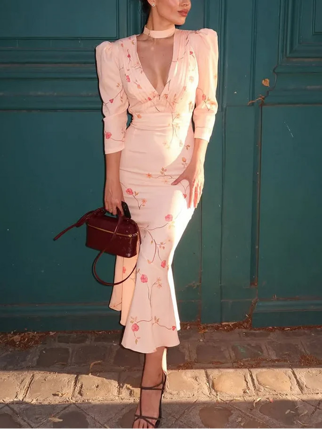 FJØRNA cottagecore V-neck women's midi dress with floral pattern, perfect for day to night wear, featuring a soft, flowing fabric.