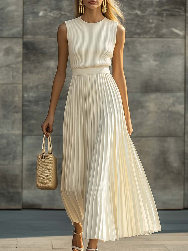 Cream chiffon pleated maxi dress by FJØRNA featuring flowing fabric and elegant pleats, perfect for casual or formal occasions.