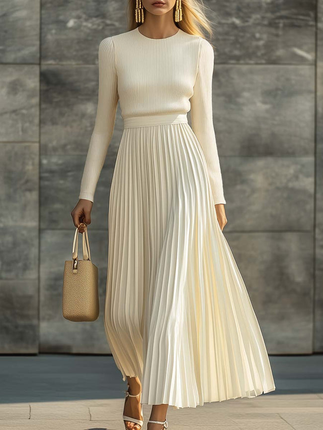 Cream satin pleated maxi dress by FJØRNA featuring a flowy silhouette, casual style, and elegant pleats for a sophisticated look.