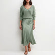 Cyan satin two-piece women's co-ord set featuring a flowy top and matching pants, stylish and elegant FJØRNA clothing ensemble.