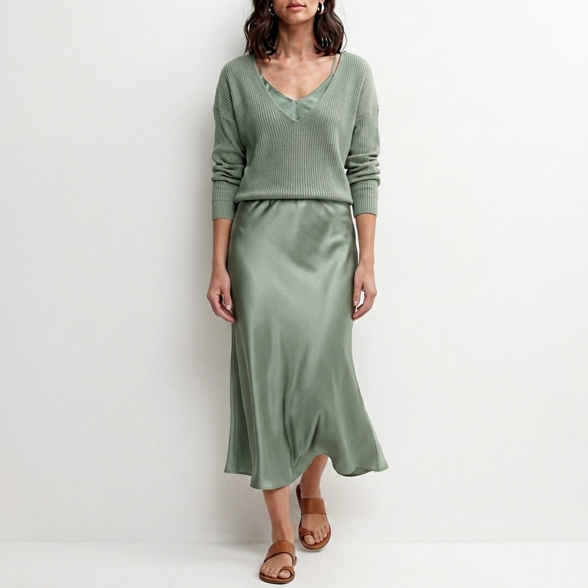 Cyan satin two-piece women's co-ord set featuring a flowy top and matching pants, stylish and elegant FJØRNA clothing ensemble.