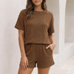 Dark brown FJØRNA women's two-piece knit co-ord set with pockets, featuring a stylish and comfortable matching top and pants.