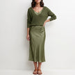 Dark green satin two-piece women's co-ord set from FJØRNA featuring a flowy, elegant design and stylish fit.