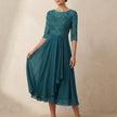 Dark green FJØRNA elegant midi bodycon chiffon dress for women, showcasing a fitted silhouette and flowing fabric.