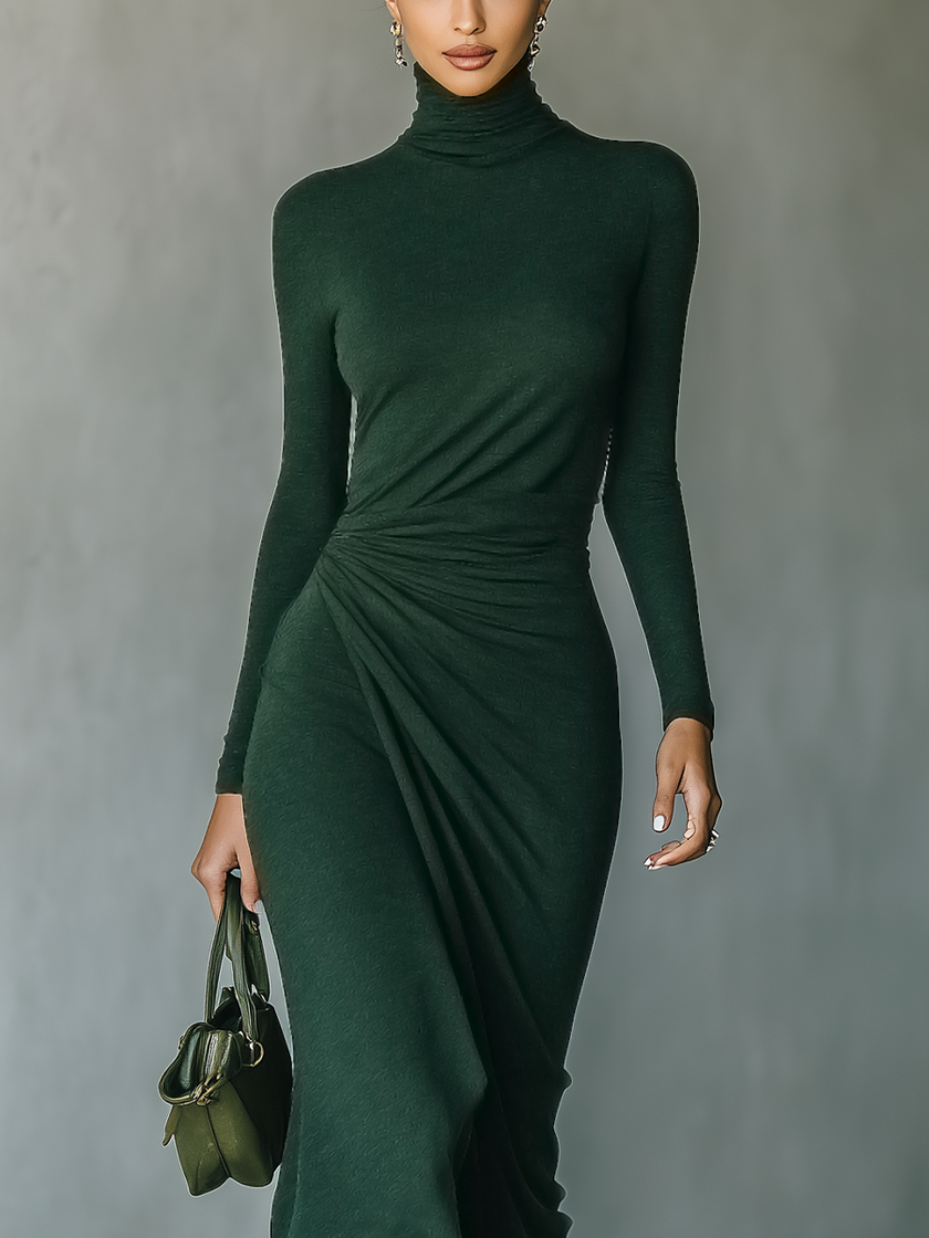 Dark green knit wrap midi dress for women by FJØRNA, featuring a fitted waist and flowing skirt, styled with long sleeves.