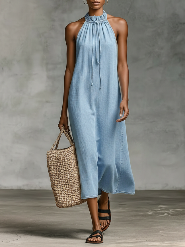 Denim sleeveless midi dress for women by FJØRNA, showcasing a fitted bodice and flowing midi-length skirt.