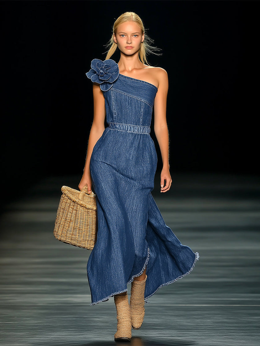 FJØRNA denim strapless maxi dress displayed on a hanger, featuring a flowing design and casual evening dress style.