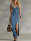 FJØRNA denim V-neck maxi dress with button details for women, featuring a flowing silhouette and sleeveless design.