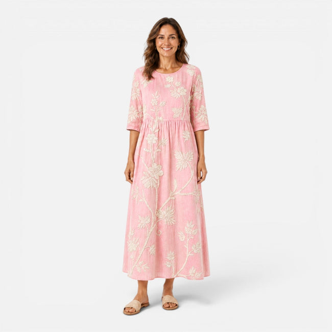 Lightweight women's summer floral midi dress by FJØRNA with bohemian-inspired floral print and flowing silhouette.