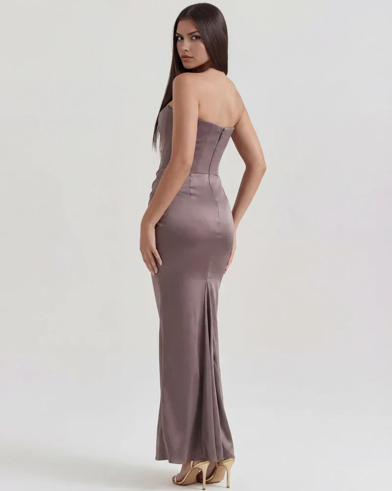 Velvet women's strapless corset maxi dress with ruched detail by FJØRNA, featuring a fitted bodice and flowing skirt.