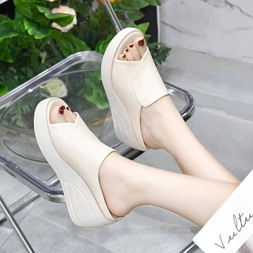 FJØRNA women's orthopedic slip-on shoes with wedge heels, featuring comfortable design and supportive soles, shown on a model.