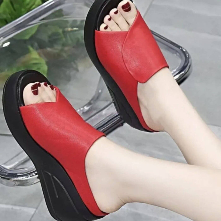 FJØRNA women's orthopedic slip-on shoes with wedge heels, featuring supportive design and comfortable fit, shown in a stylish profile.