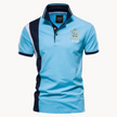 Men's short-sleeve FJØRNA Agri Polo shirt with a classic collar, navy blue color, and subtle branding on the chest.