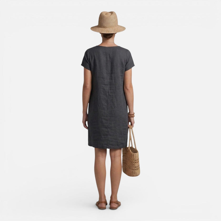 Women's FJØRNA lightweight relaxed fit dress with breathable fabric and pockets, perfect for casual wear.