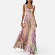Women's floral elegant maxi dress by FJØRNA featuring a flowy design and side pockets, perfect for stylish occasions.