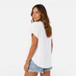 FJØRNA women's lightweight V-neck buttoned T-shirt with relaxed fit, perfect for summer, shown on a model.