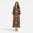 FJØRNA women's bohemian floral maxi dress with flowing fabric and vibrant print, perfect for summer or casual wear.