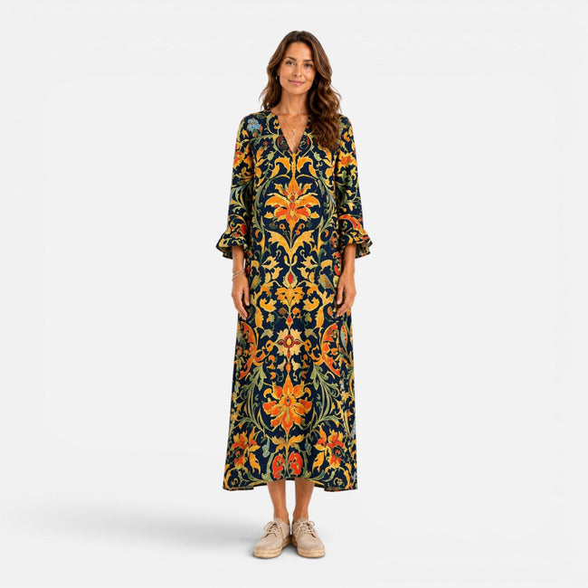 FJØRNA women's bohemian floral maxi dress with flowing fabric and vibrant print, perfect for summer or casual wear.