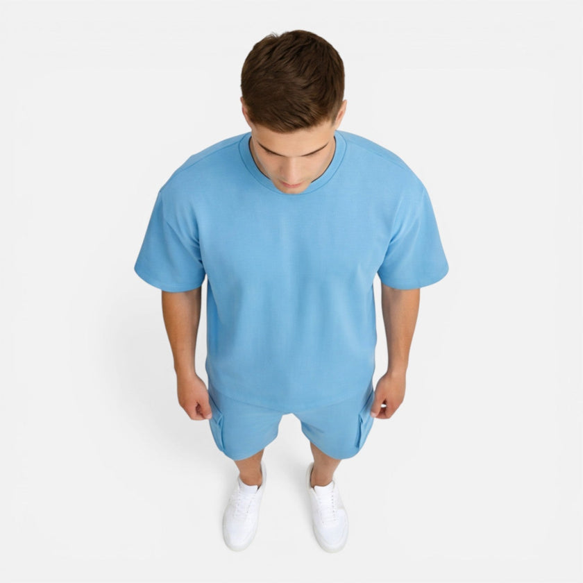Men's casual summer matching T-shirt and cargo shorts set by FJØRNA, featuring a relaxed fit and comfortable fabric.