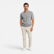 Men's slim fit knit polo shirt by FJØRNA, lightweight and breathable, shown in a close-up of the shirt's fabric and collar.