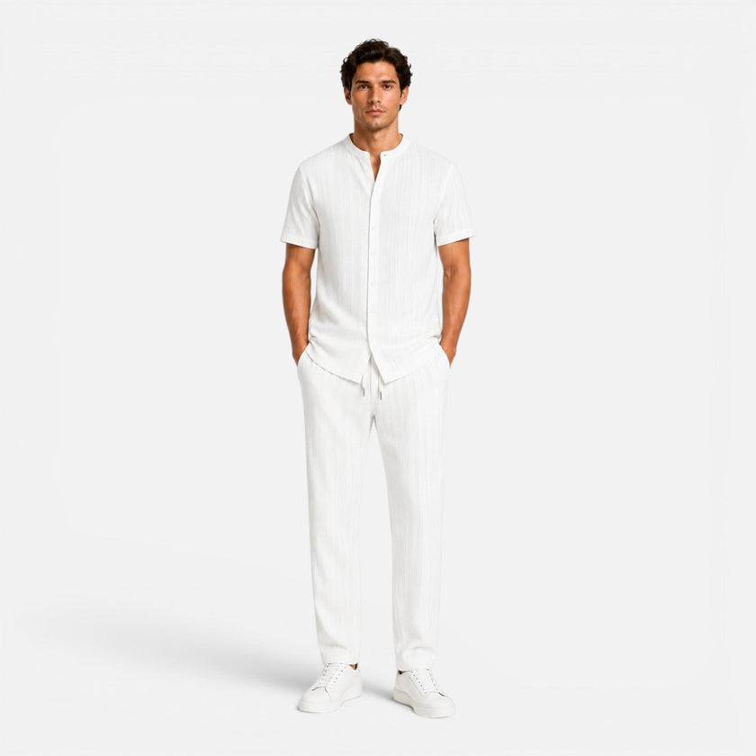 Men's summer matching set by FJØRNA featuring lightweight shirt and trousers, casual and breathable for warm weather.
