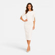 Women's elegant midi sheath dress by FJØRNA featuring tailored fit and pearl split sleeves, showcased on a model.